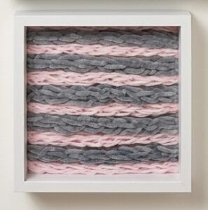 pink and dusty blue finger knitted art