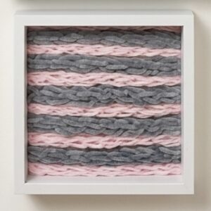 pink and dusty blue finger knitted art